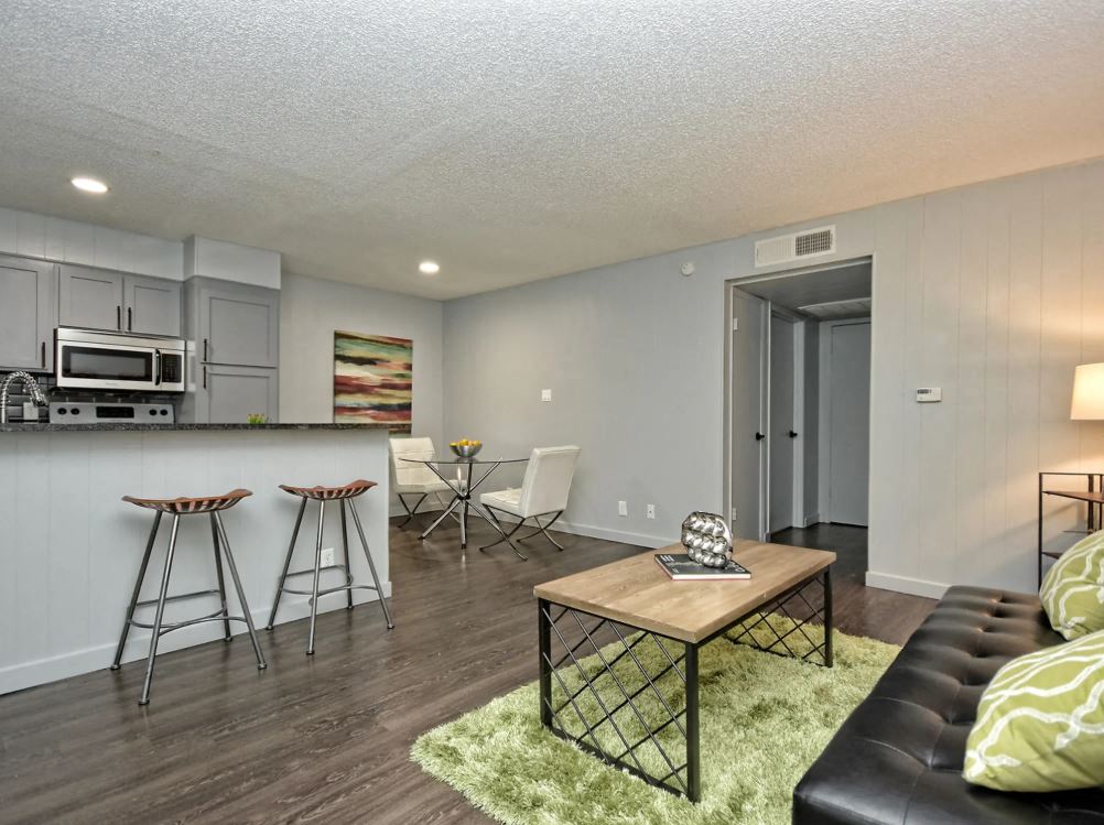 a living room with a bar and a couch